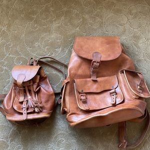 Selling 2 genuine handmade leather backpacks / bags for him & her. Large & small